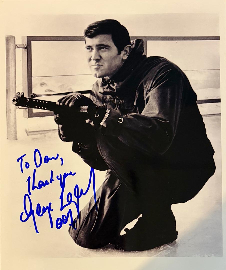 George Lazenby Signed, inscribed 8X10 Photo (James Bond) - SWAU COA